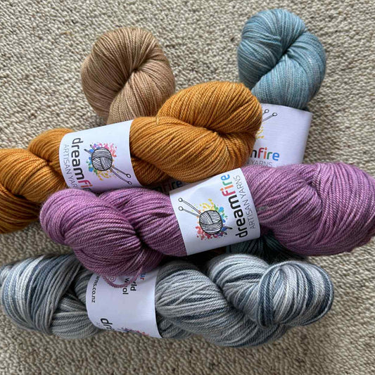 Five skeins of Clayton Sport yarn in various colors
